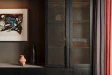 07 The storage is hidden, there’s a large windowsill with additional storage space and many artworks