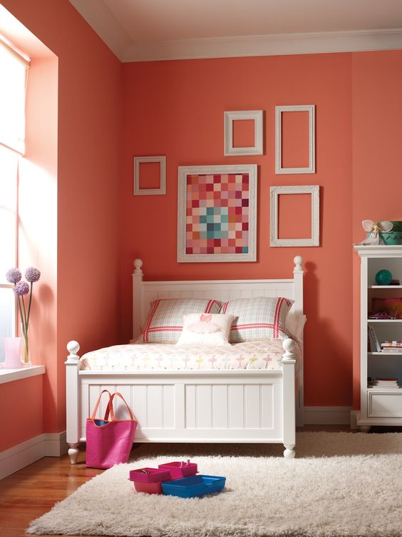 a girlish bedroom with coral walls is a cheerful idea if you love this color, as for other items, go for neutrals