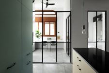 08 Some of the spaces are separated with glass doors with thin framing to let light in