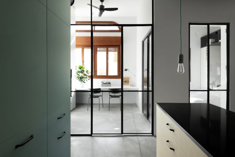 Some of the spaces are separated with glass doors with thin framing to let light in