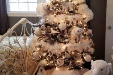 08 a kid’s Christmas tree decorated with polar bears, white snowy ornaments, lights and even penguins is a whimsy idea