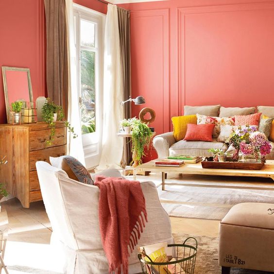 coral walls give a vivacious tone to the living room and make it bright, if you are ready for much color, go repaint the walls