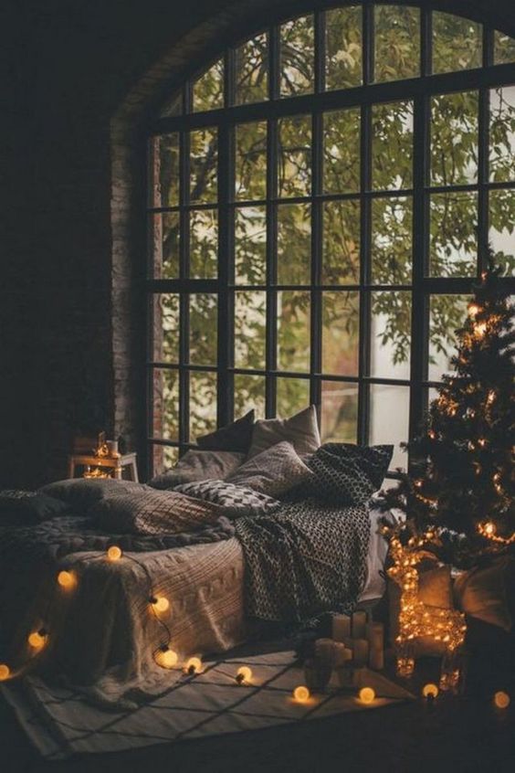 you can make any bedroom Christmassy with lights - a lit up tree, a lit up deer and vintage lights