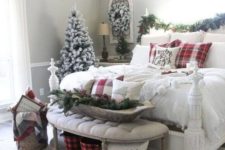 09 a farmhouse Christmas bedroom with evergreens, a flocked tree and wreath, a dough bowl with evergreens and plaid