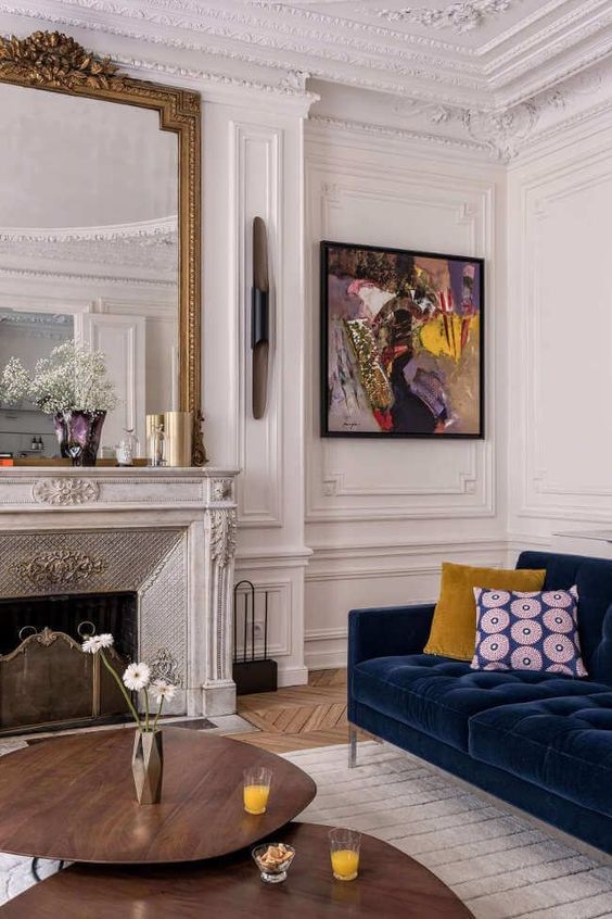 start with neutrals as a base adding colorful furniture items and artworks for a bolder look