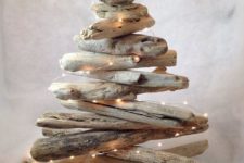 easy DIY christmas tree made of driftwood pieces and string lights