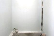 12 a concrete bathtub is a cool idea to rock in a minimalist bathroom, it’s durable and comfortable