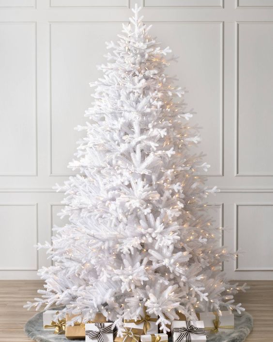 a white Christmas tree decorated with lights is a beautiful and non typical idea