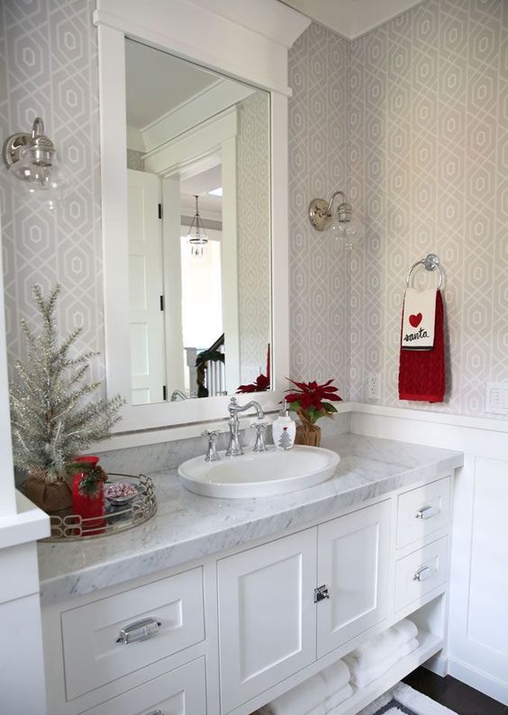 a neutral space can be dotted with bold shades like red or green, just a couple of jars, towels and plants can add color