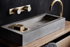 13 a sleek concrete geometric sink is accented with gold fixtures to give it a softer and chic look