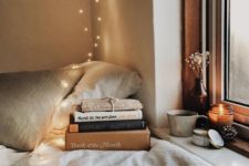 13 create a cozy reading nook by the window and if natural light isn’t enough, add LEDs