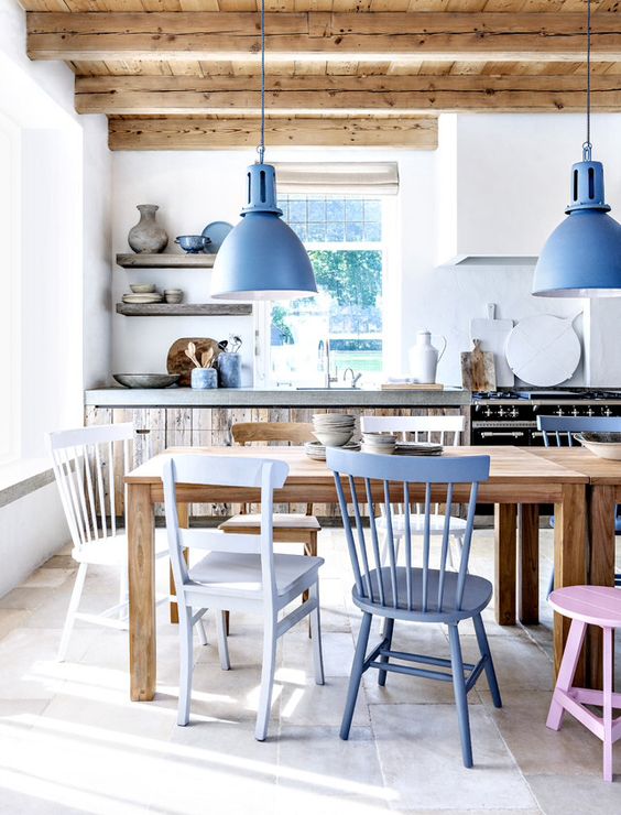 pendant lamps are echoing the chair and even some tableware to create a chic beach space
