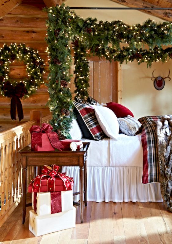 a welcoming and bold traditional Christmas bedroom with evergreen garlands and wreaths, lights and pinecones
