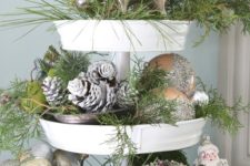 snowy christmas display with pinecones