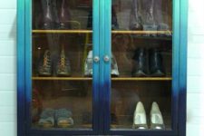 19 a vintage shoe cabinet with a gradient effect from turquoise to navy is a bold and beautiful option