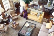 19 a yellow sofa and yellow pillows tie up the different sofas together making them more matching
