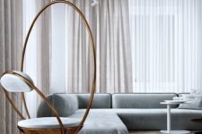 21 a bold suspended chair in brass and grey is a chic statement idea for a modern living room