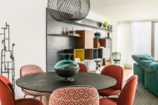 21 coral chairs with printed backs make the dining space interesting, it’s a simple way to rock a trendy shade