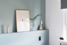22 a muted green statement wall makes the space soft and welcoming, and you may change the color anytime