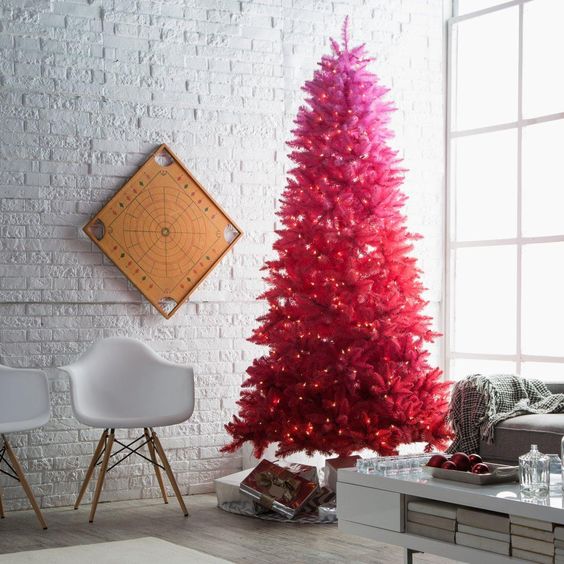 a vintage ombre pink to red pre-lit Christmas tree is a bold idea for any neutral space, it doesn't require any decor