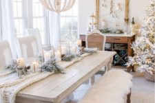23 a white table setting with a knit throw, a faux fur throw on the bench and snowy evergreens