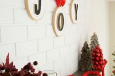 23 hoops with letters and red bows and ribbons are an amazing wall decoration for Christmas