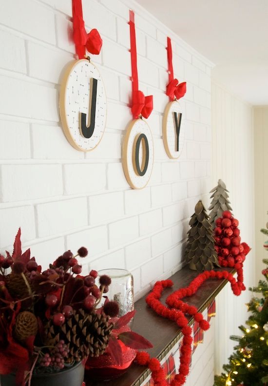 hoops with letters and red bows and ribbons are an amazing wall decoration for Christmas