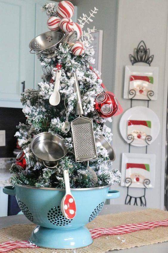 a tabletop Christmas tree decorated with kitchen stuff is a fun and whimsy idea
