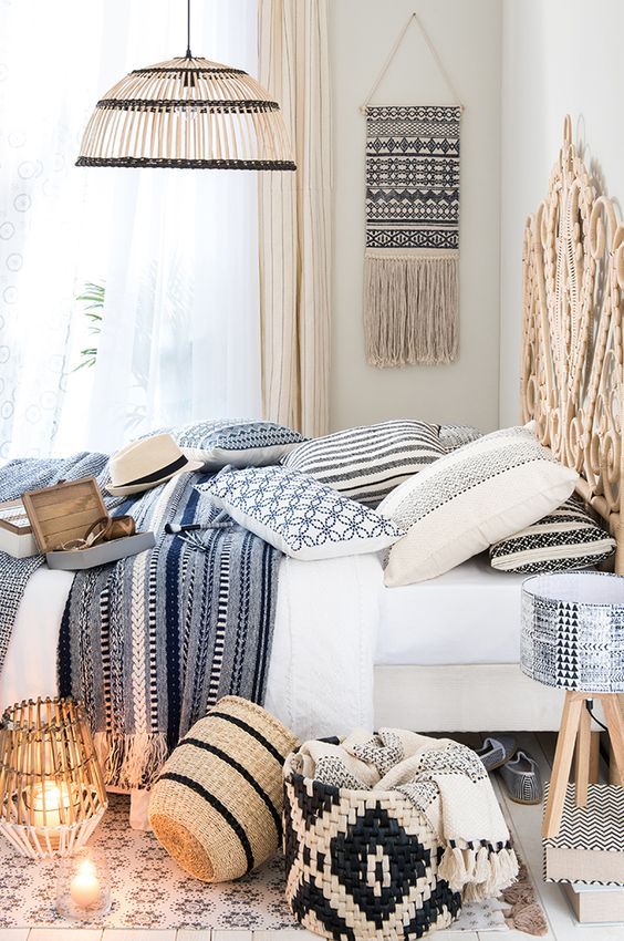 lots of printed textiles, wicker baskets, lamps, a headboard and a hanging make the bedroom Mediterranean at once lots of printed textiles, wicker baskets, lamps, a headboard and a hanging make the bedroom Mediterranean at once
