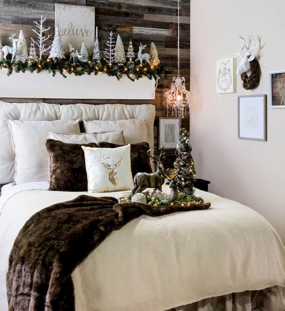 cabin Christmas bedroom with glam charm and faux fur, with silver trees and deer, with lots of pillows and a gallery wall
