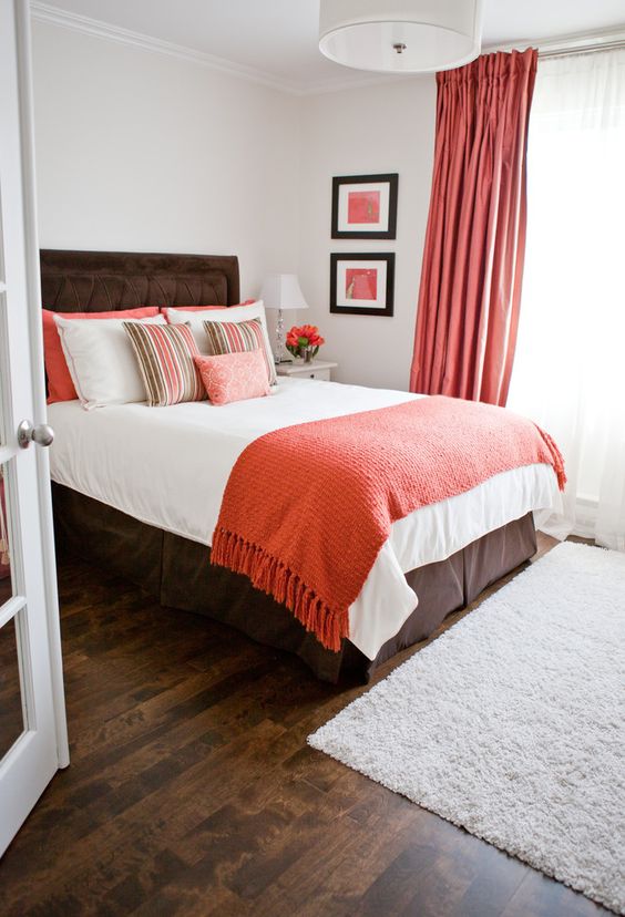 coral curtains, a coral throw and pillows add a trendy colorful touch to the bedroom and make it cheerful coral curtains, a coral throw and pillows add a trendy colorful touch to the bedroom and make it cheerful