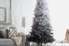 25 if you want a monochromatic Christmas tree, rock an ombre one from white to silver and black and add lights for a modern look