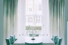 25 ombre green to white curtains and matching green chairs create a peaceful and welcoming dining room