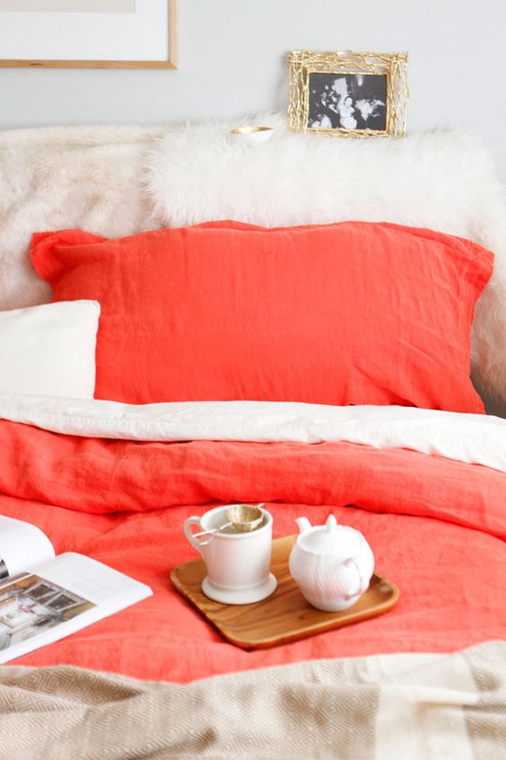 neutral bedding with coral accents is a gorgeous way to incorporate this trendy color into your bedroom decor neutral bedding with coral accents is a gorgeous way to incorporate this trendy color into your bedroom decor