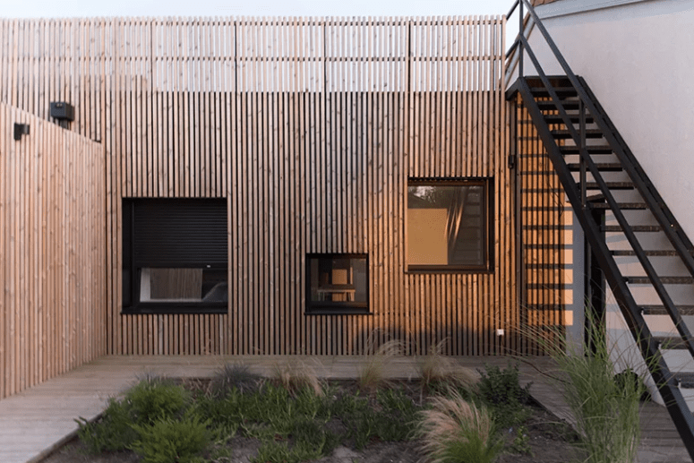 This house is located on the French seaside and is clad with pine slabs for a modern look