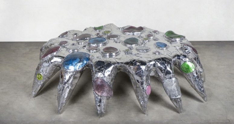 The coffee table is inspired by gargantuan, a jewel hording crab, and it really resembles that sort of creature