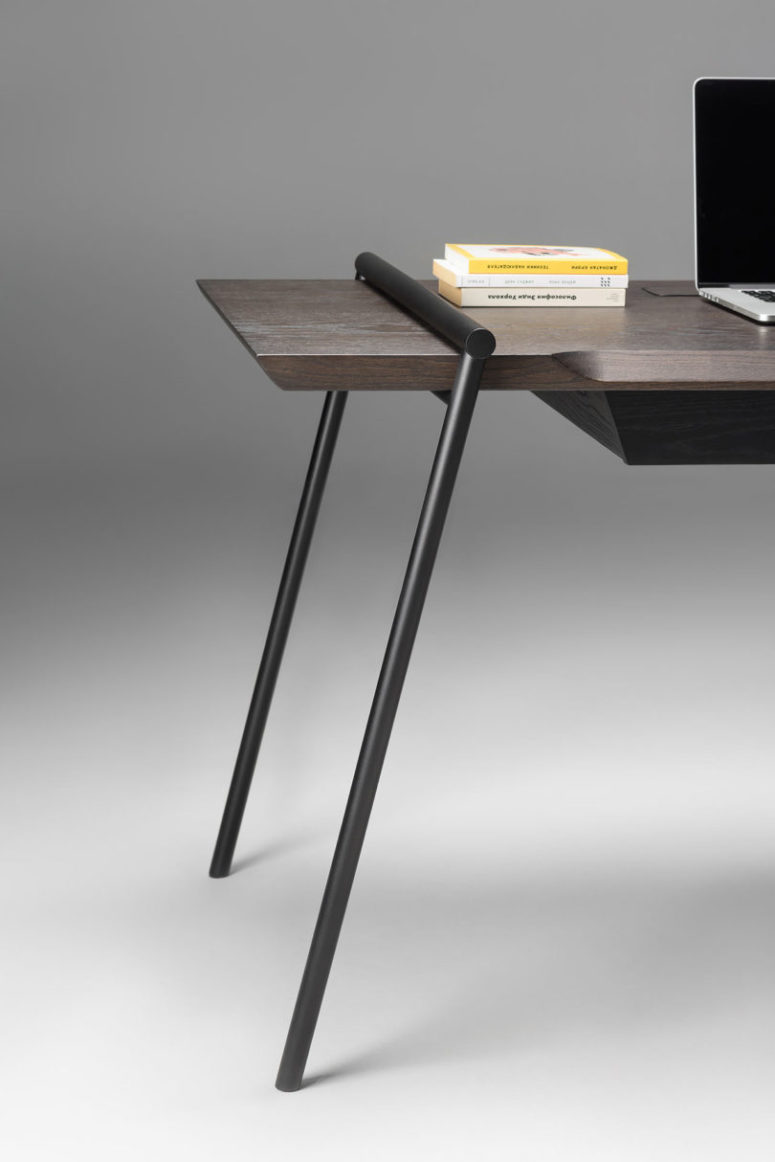 stylish minimalist desk design The desk is made of dark and stylish veneer, and there are matte black legs placed in a catchy way