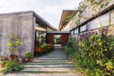 02 The home features chic landscaping and some outdoor zones