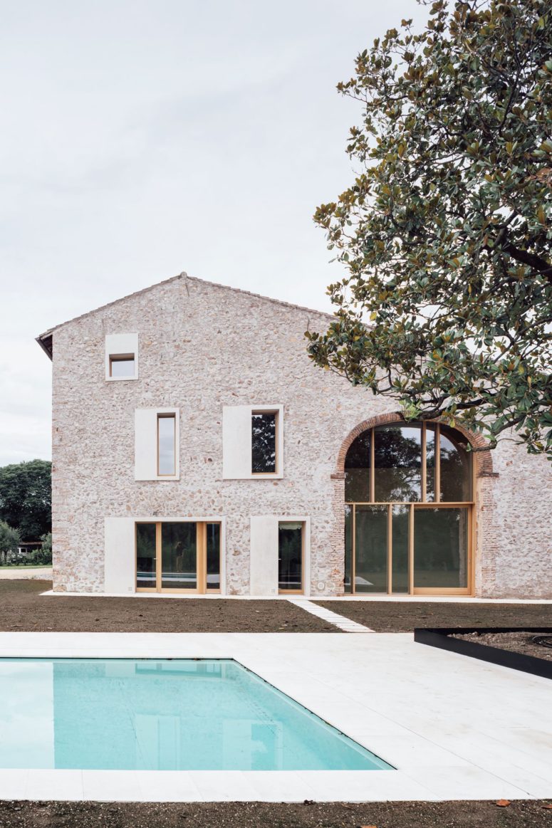 The house features various windows here and there that give much natural light to the inner spaces