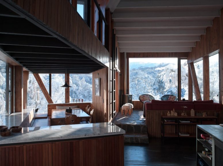 large open layout is perfect for mountain homes The main space is a large open layout with a kitchen, dining and living room all done in the same materials and style to unite it