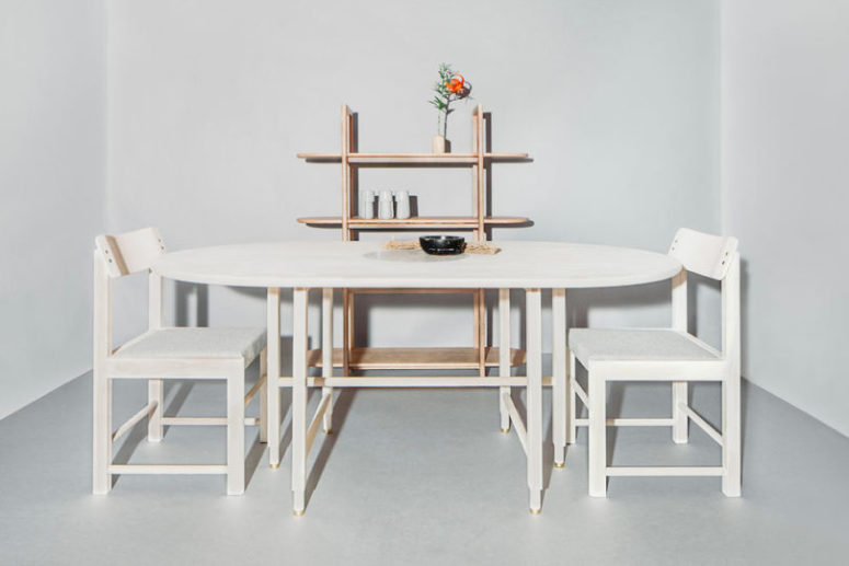 This is a dining table, chairs and an open shelving unit that all feature similar legs and curved angles that are characteristic features of the collection