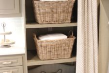 02 a laundry room with storage cabinets and an incorporated dog bed for your pet to relax while you are doing things