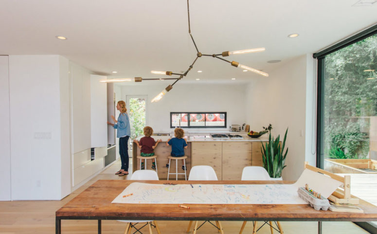 The furniture is minimalist and the storage is hidden in the cabinets to declutter the space