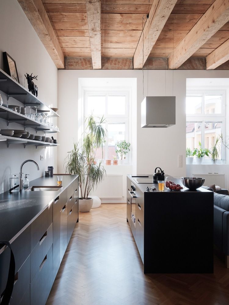 The kitchen and entryway are integrated into the living room cohesively to achieve a stylish look