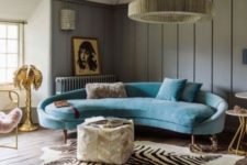 03 a refined and chic blue curved couch brings color and a sophisticated feel to the living room