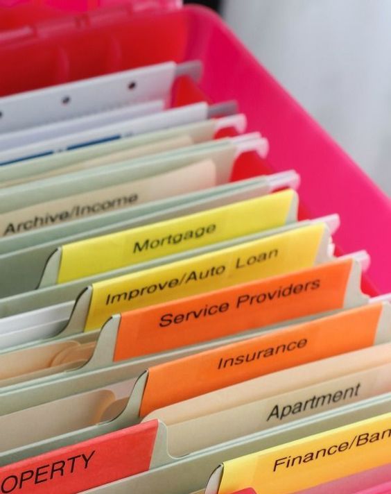 a simple paper storage solution with files and colorful tags is a cool modern idea