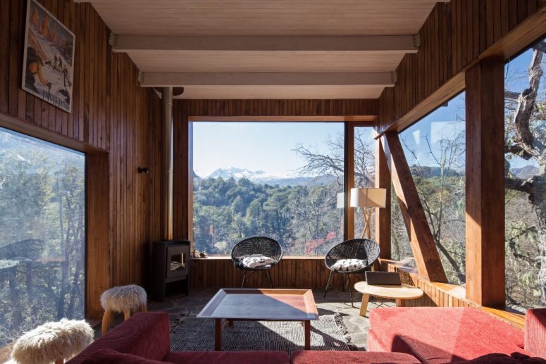 The living rooms also feature several panoramic windows to enjoy the mountains and comfy furniture plus a hearth The living rooms also feature several panoramic windows to enjoy the mountains and comfy furniture plus a hearth