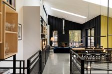 04 The overall decor continues this idea, there’s concrete, black painted wood and much blackened metal
