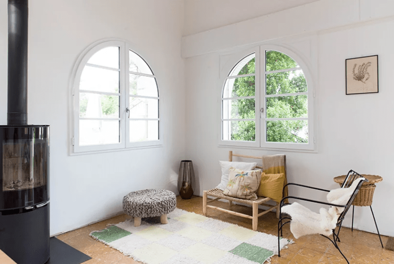 This little cozy nook is done with some quirky seatings in various styles and a cool hearth
