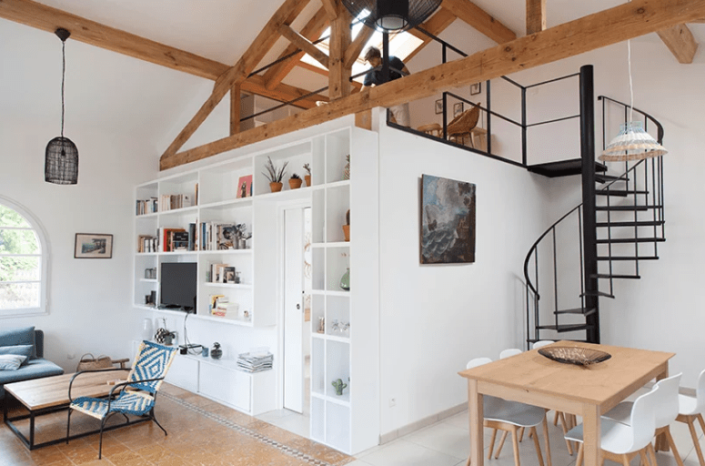 The living space features much storage, there's some cool furniture and a hidden bathroom plus a space on the second floor